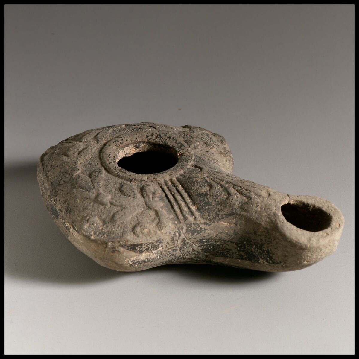 Terracotta oil lamp, Terracotta, Greek or Roman