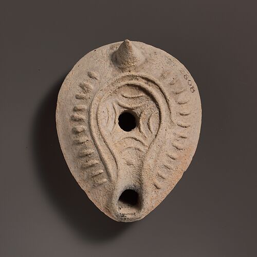 Terracotta oil lamp