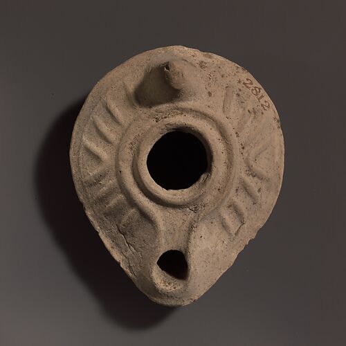 Terracotta oil lamp