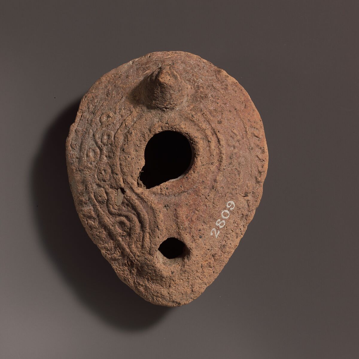 Terracotta oil lamp, Terracotta, Roman 