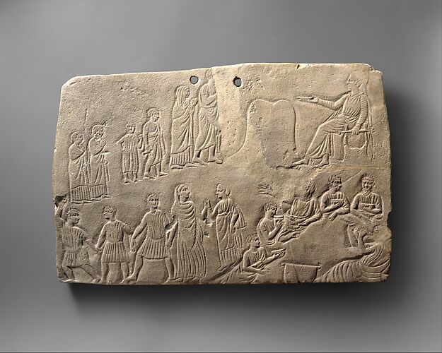 Limestone votive relief with worship and banquet scenes