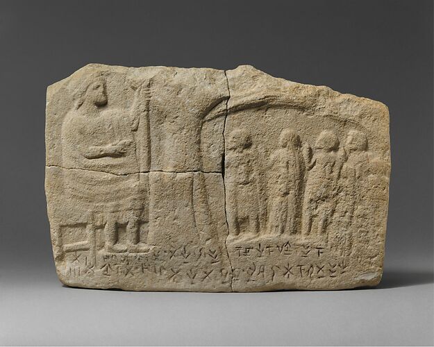 Limestone inscribed relief