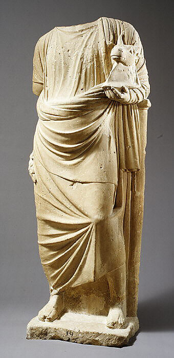 Limestone statue of a man holding a mask in the form of a bull's head, Limestone, Cypriot