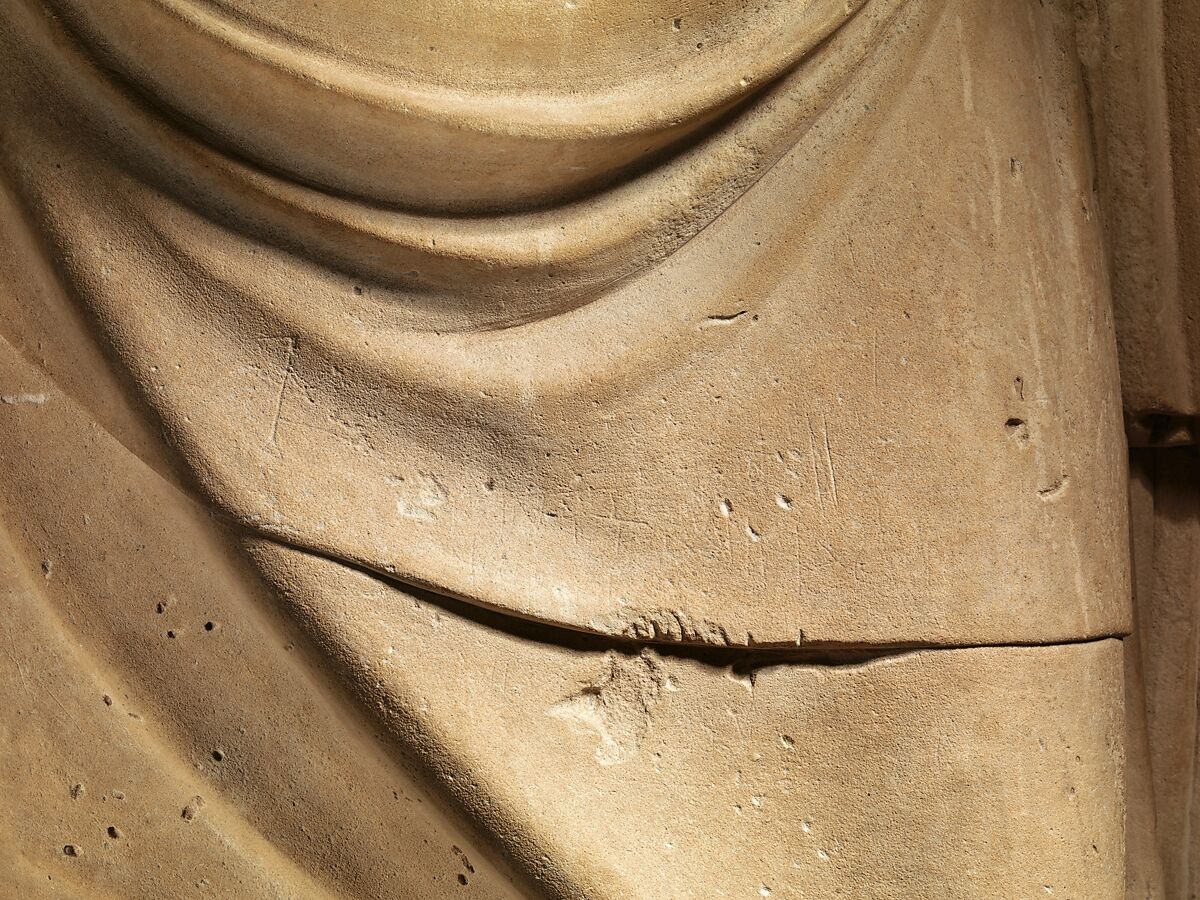 Limestone statue of a man holding a mask in the form of a bull's head, Limestone, Cypriot