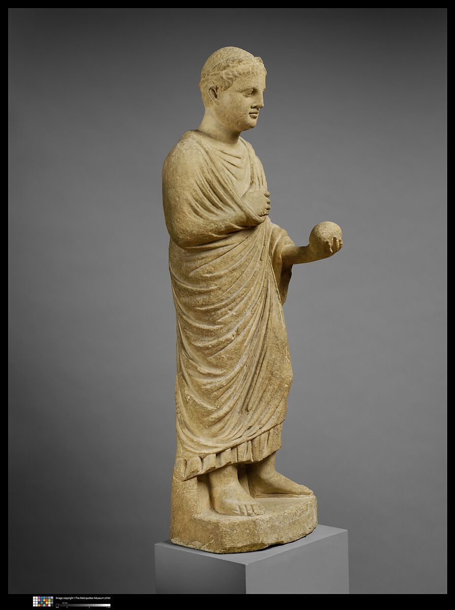 Limestone statue of a wreathed boy holding a ball or piece of fruit, Limestone, Cypriot