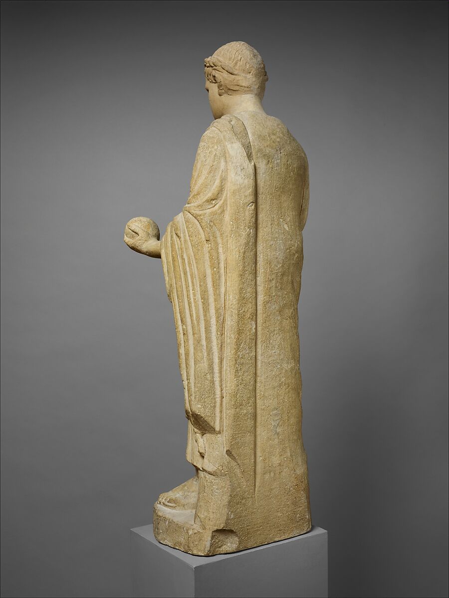 Limestone statue of a wreathed boy holding a ball or piece of fruit, Limestone, Cypriot