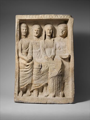 Limestone funerary monument with four figures