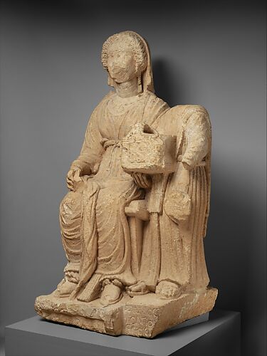Limestone funerary monument of a woman