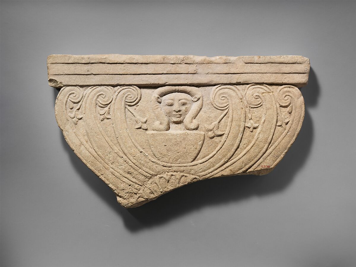 Limestone finial of a funerary stele with volutes and the head of Hathor, Limestone, Cypriot 