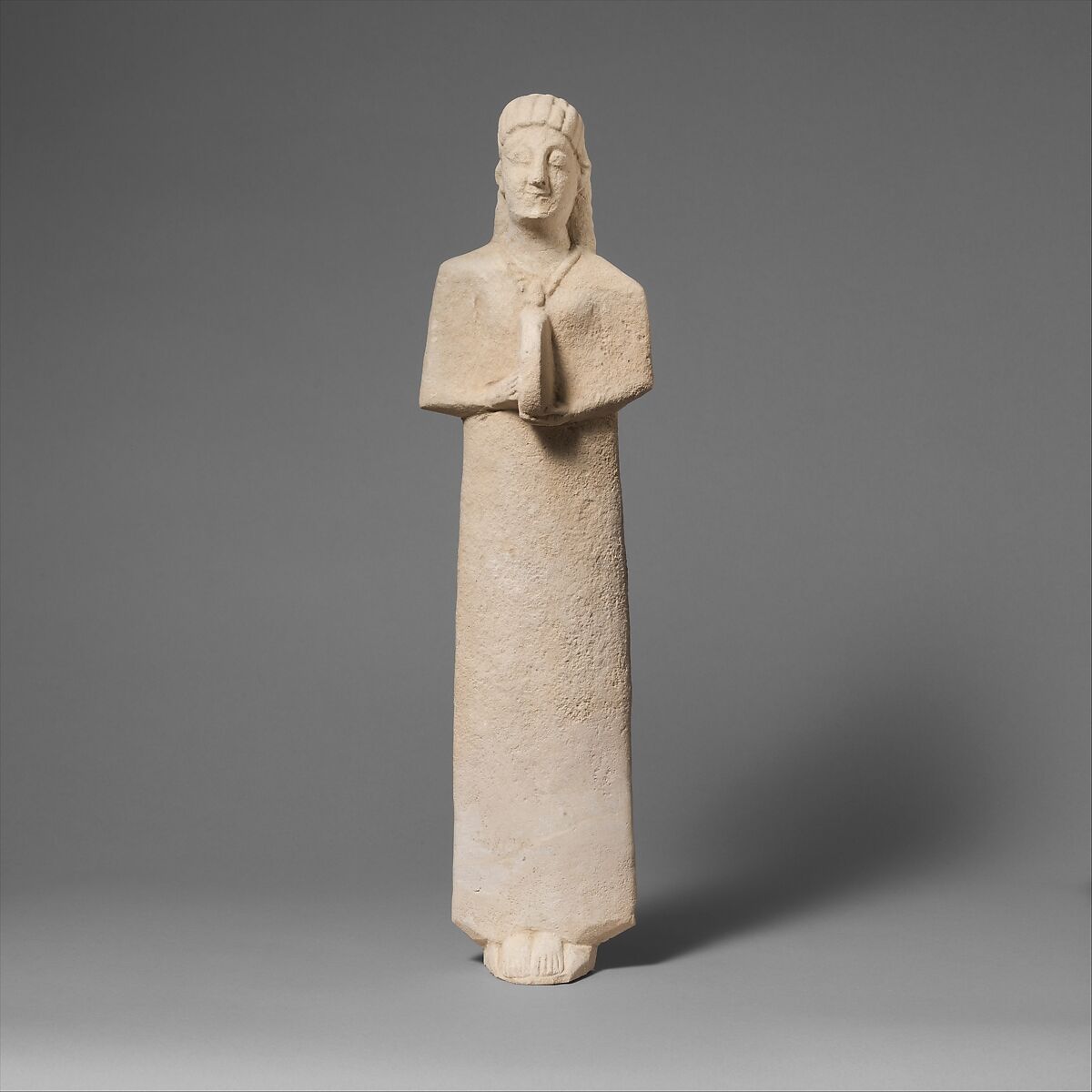 Limestone statuette of a female votary (worshipper) playing a tambourine, Limestone, Cypriot 