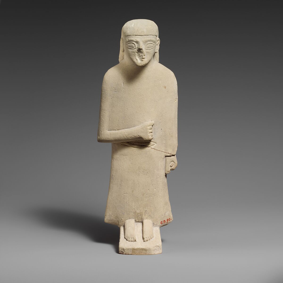 Limestone statuette of a male votary with a long garment and a plain headdress, Limestone, Cypriot 