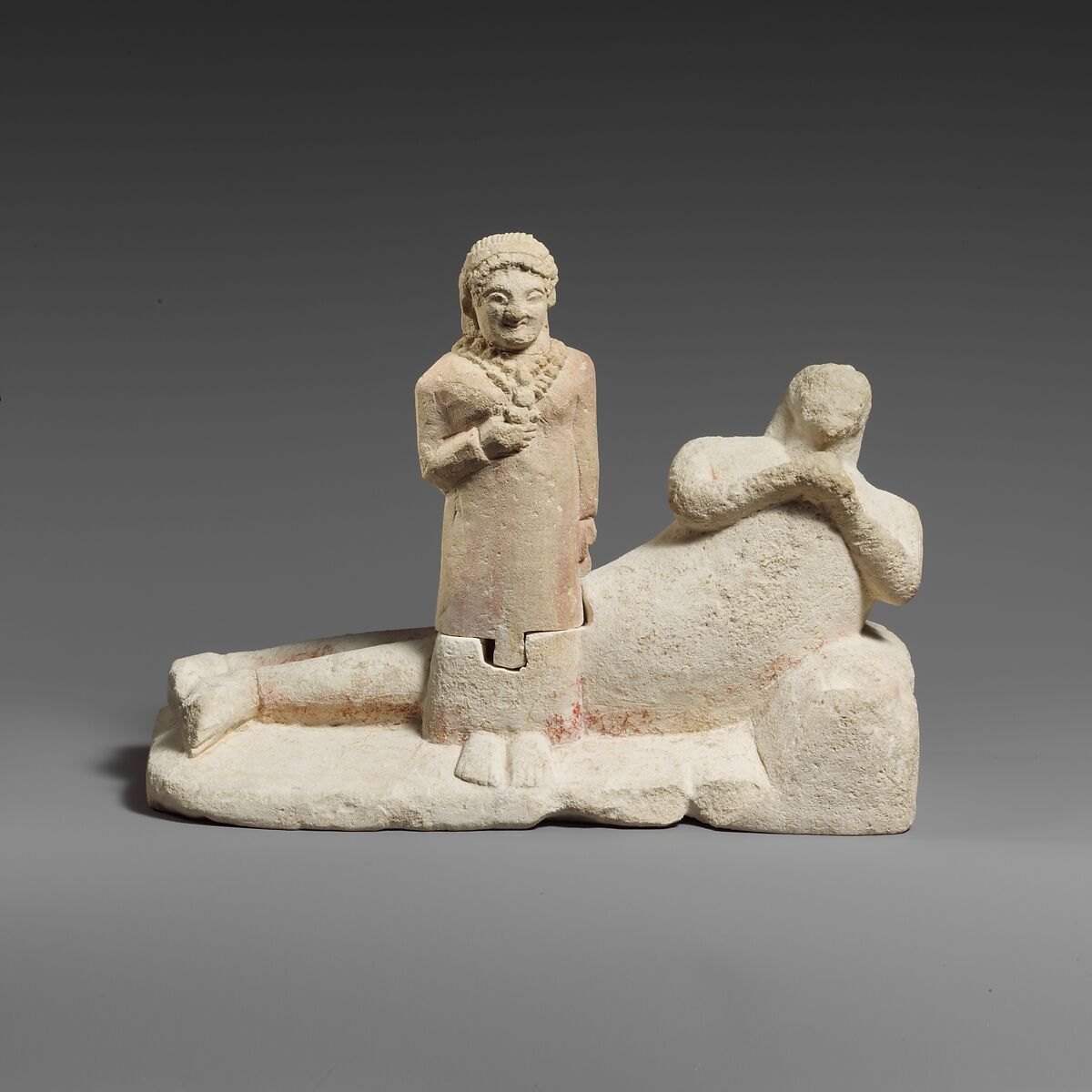 Limestone group of a male banqueter and a woman, Limestone, Cypriot