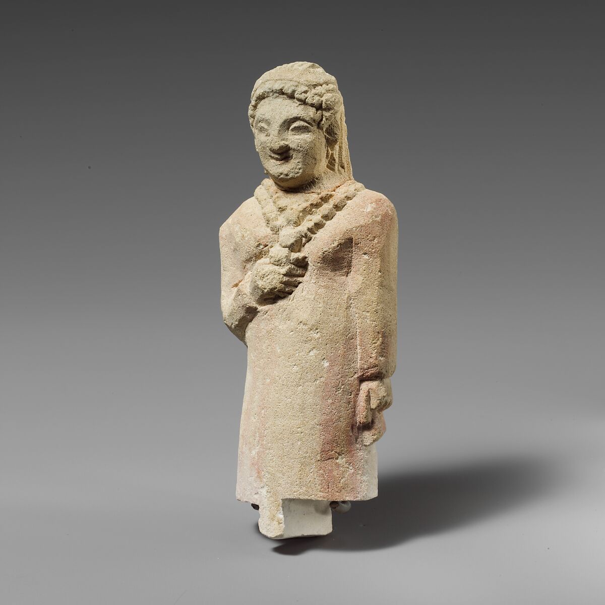 Limestone group of a male banqueter and a woman, Limestone, Cypriot