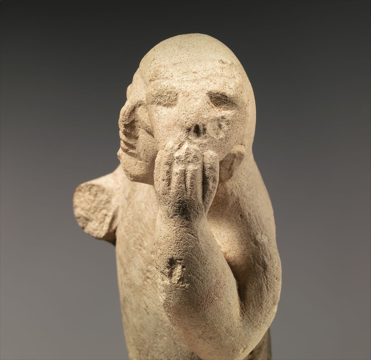 Limestone figure holding a mask, Limestone, Cypriot