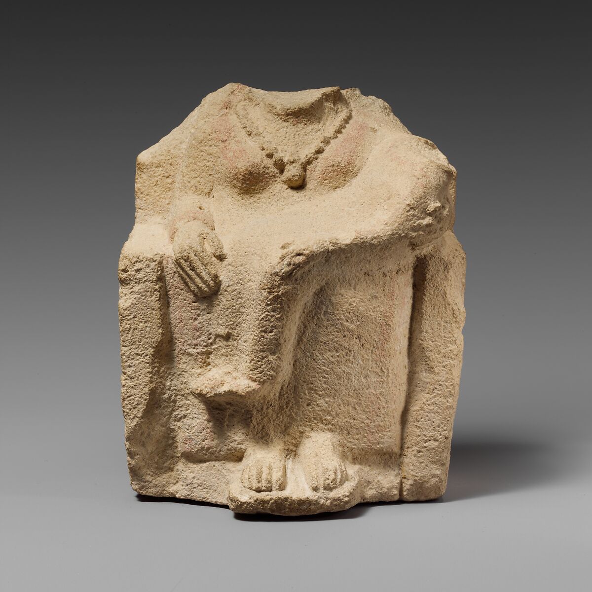 Seated limestone kourotrophos, Limestone, Cypriot 