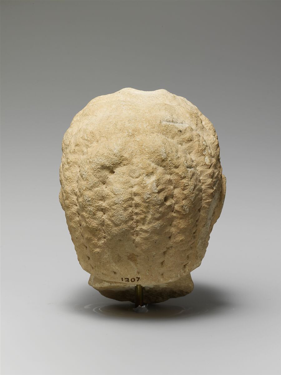 Limestone head of a beardless man, Limestone, Cypriot