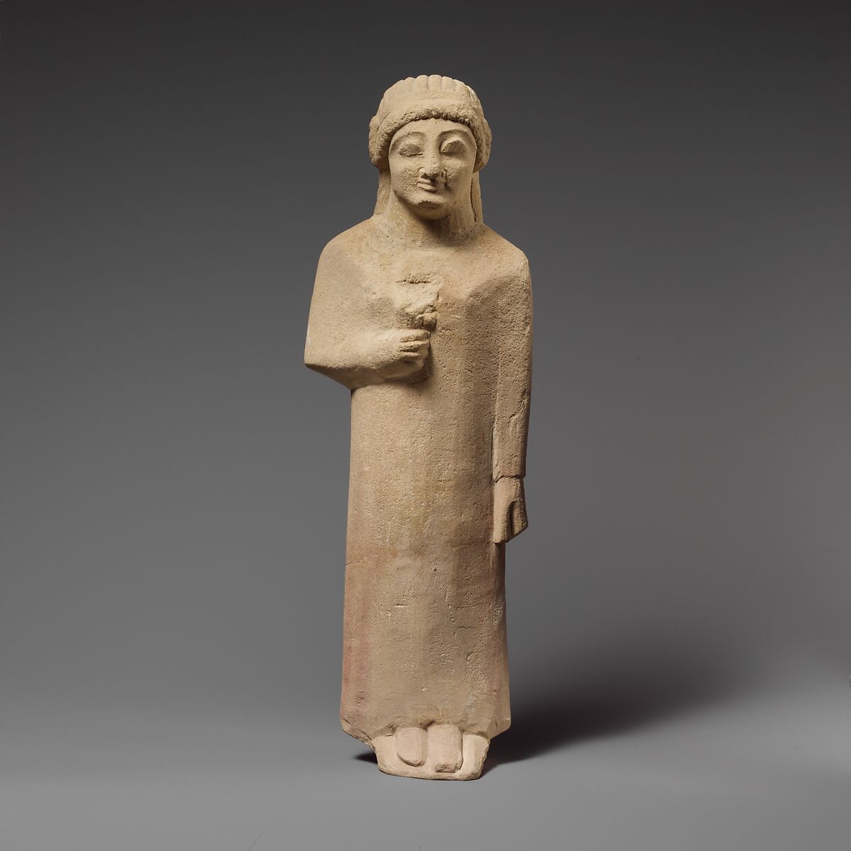 Limestone statuette of a female votary holding a flower, Limestone, Cypriot 