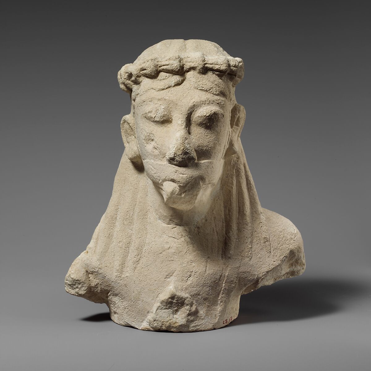 Upper part of a limestone statuette of a male aulos player, Limestone, Cypriot 