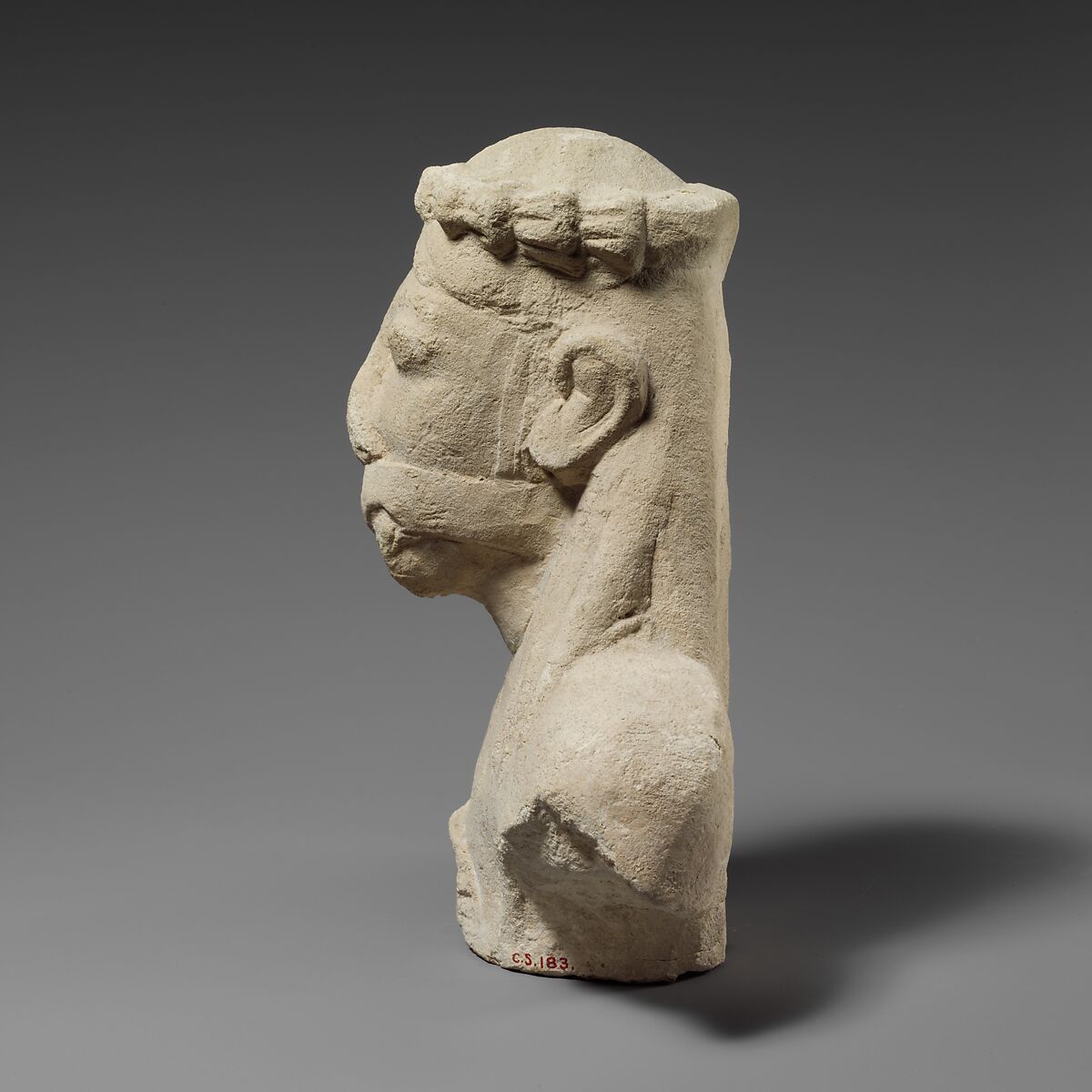 Upper part of a limestone statuette of a male aulos player, Limestone, Cypriot