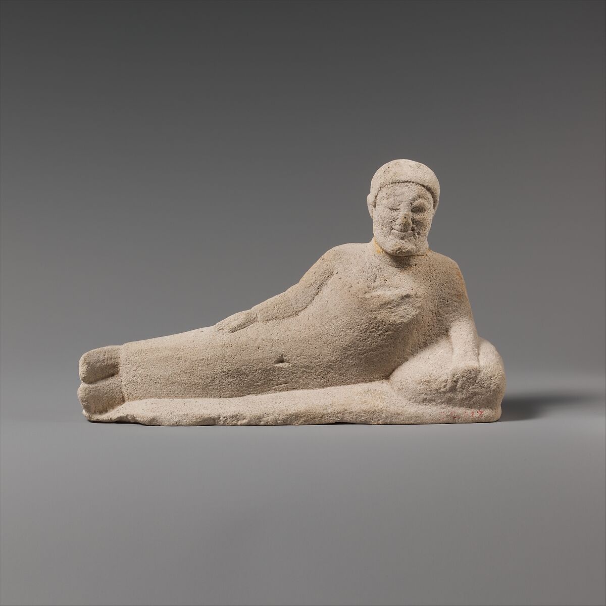 Limestone statuette of a reclining banqueter, Limestone, Cypriot 