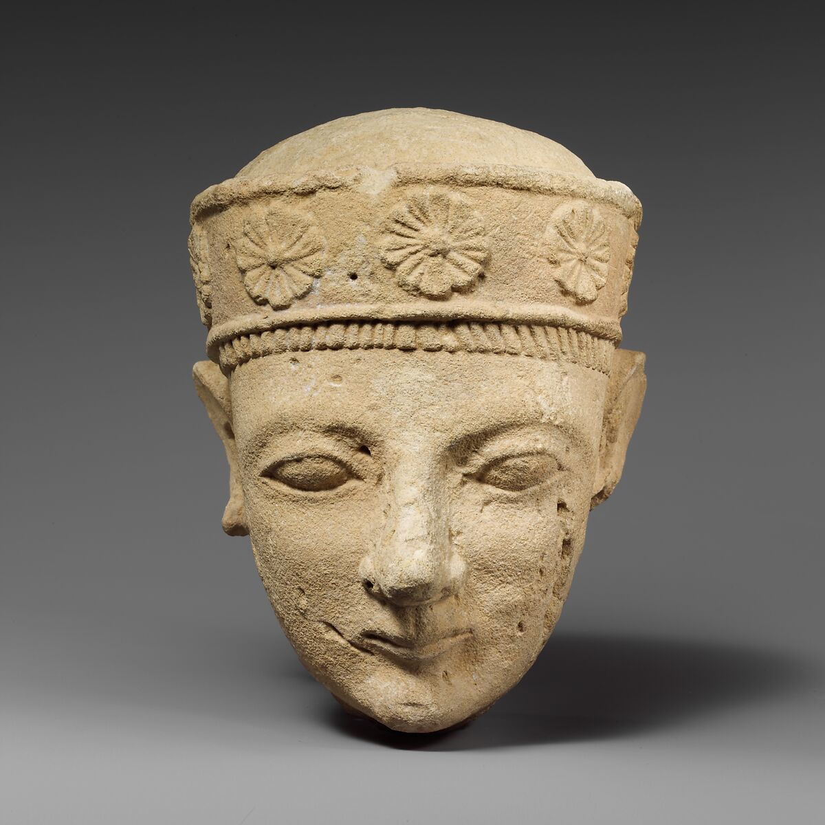 Limestone head of a beardless male with a diadem, Limestone, Cypriot 