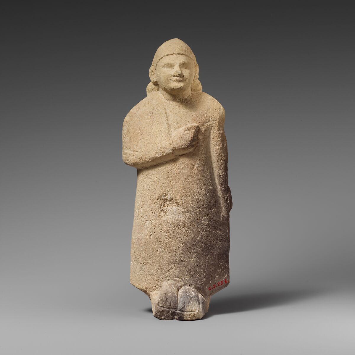 Limestone statuette of a beardless male votary with a conical helmet, Limestone, Cypriot