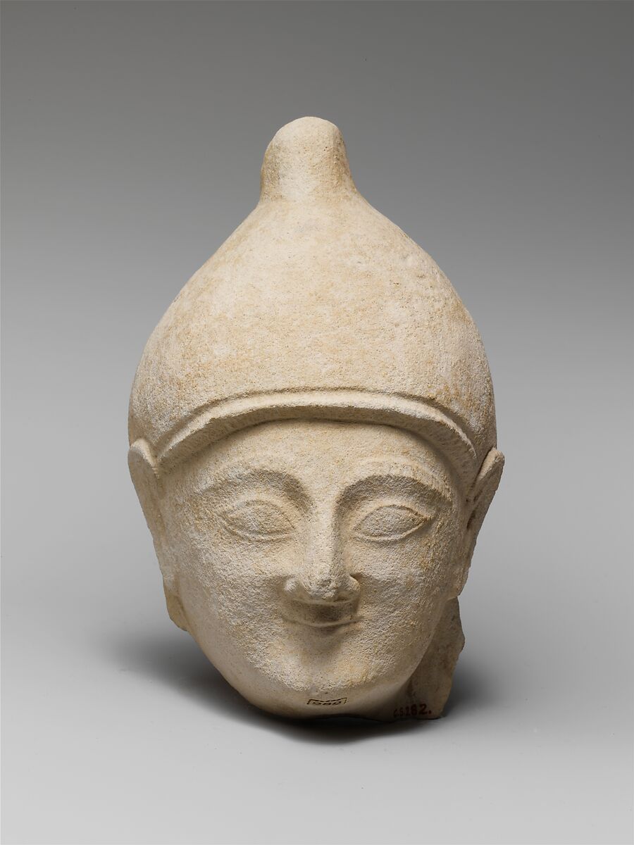 Limestone head of a man wearing a helmet, Limestone, Cypriot