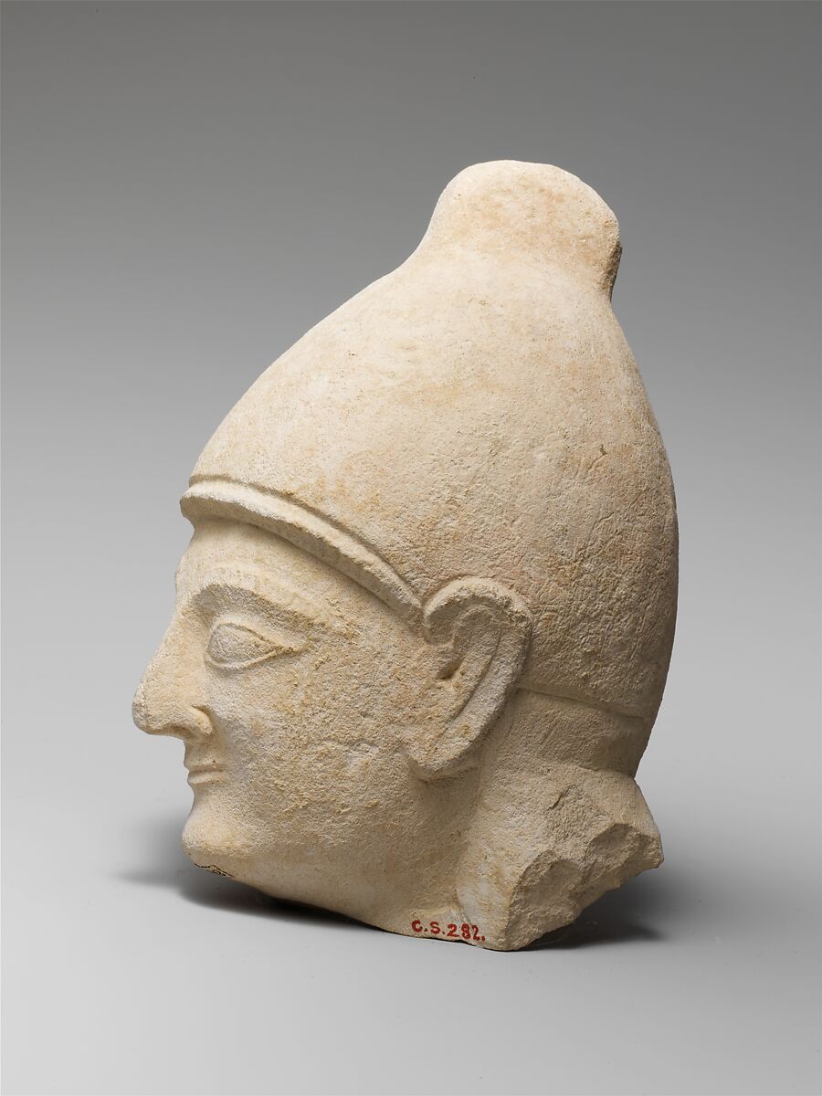 Limestone head of a man wearing a helmet, Limestone, Cypriot
