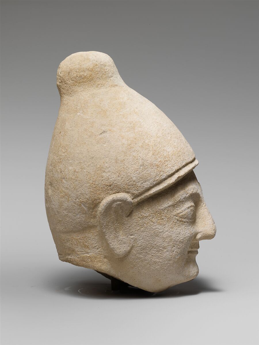 Limestone head of a man wearing a helmet, Limestone, Cypriot