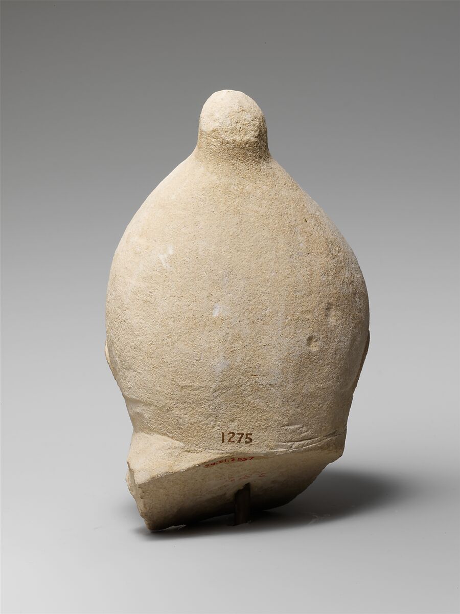 Limestone head of a man wearing a helmet, Limestone, Cypriot