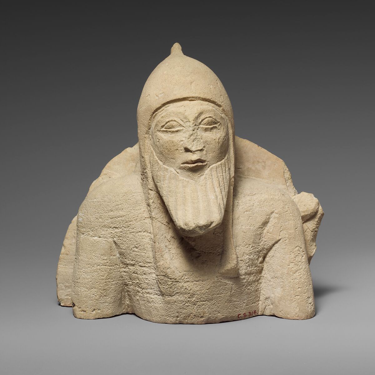 Upper part of a limestone warrior from a chariot group, Limestone, Cypriot 