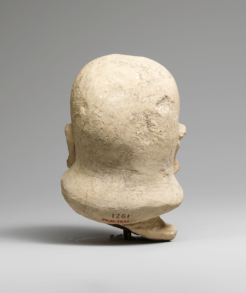 Limestone head of a man with a plain headdress, Limestone, Cypriot