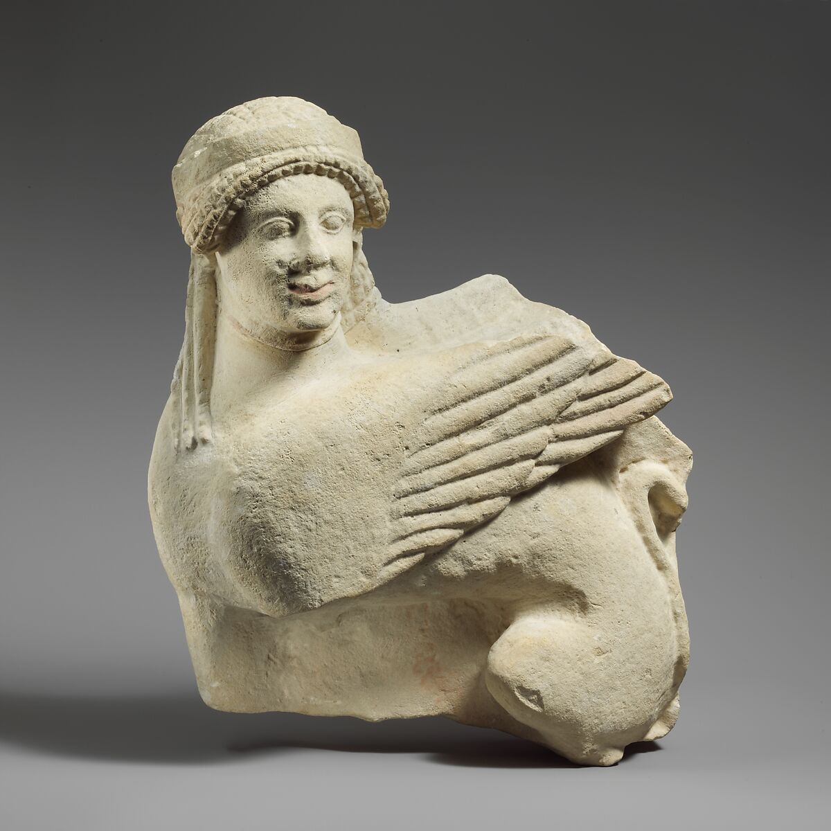 Fragment of a limestone funerary stele with a seated sphinx, Limestone, Cypriot 