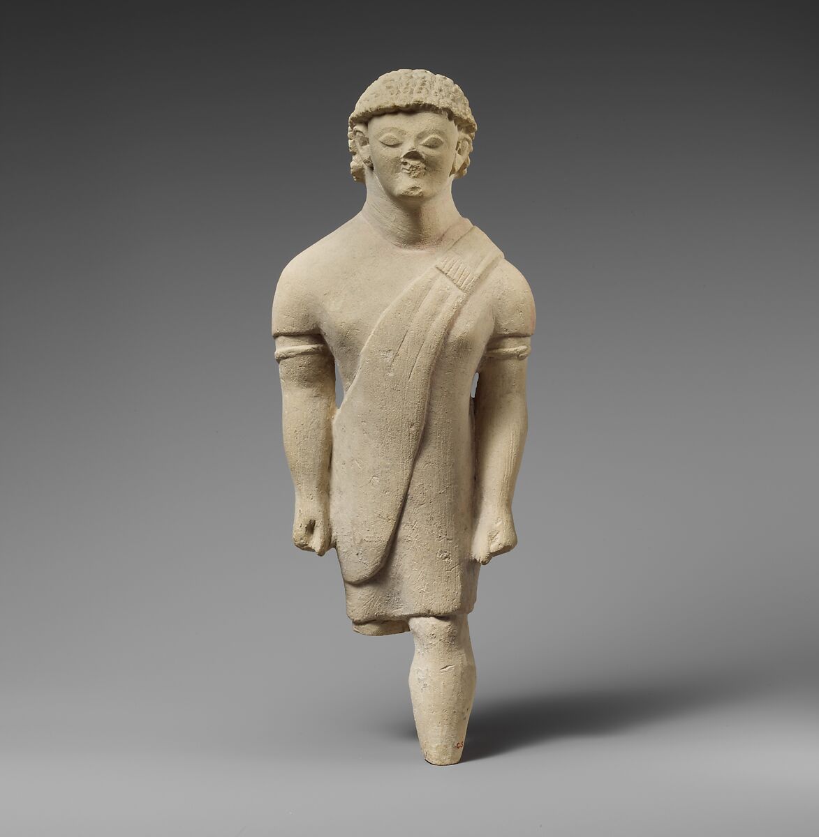 Limestone statuette of a beardless male votary in Greek dress, Limestone, Cypriot 