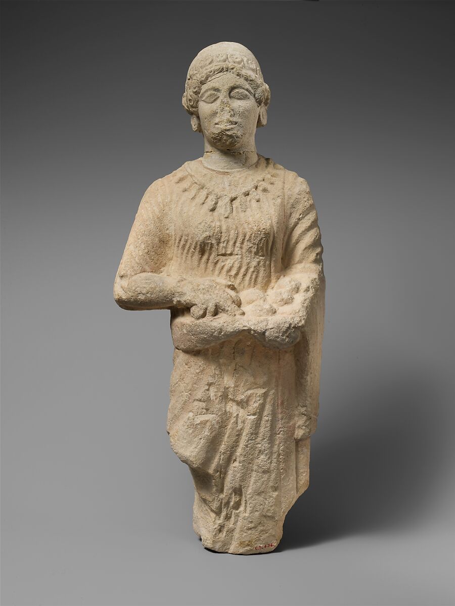 Limestone statuette of a female votary holding pieces of fruit, Limestone, Cypriot 
