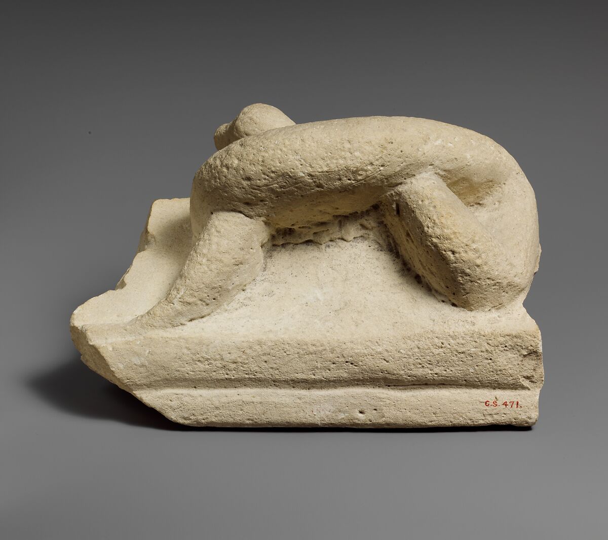 Two fragments of a limestone sarcophagus lid with snakes, Limestone, Cypriot 