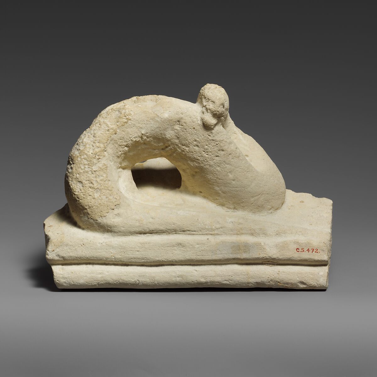Two fragments of a limestone sarcophagus lid with snakes, Limestone, Cypriot 