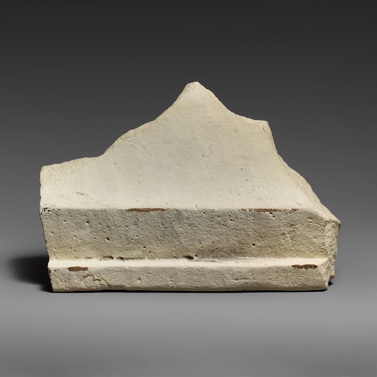 Two fragments of a limestone sarcophagus lid with snakes, Limestone, Cypriot