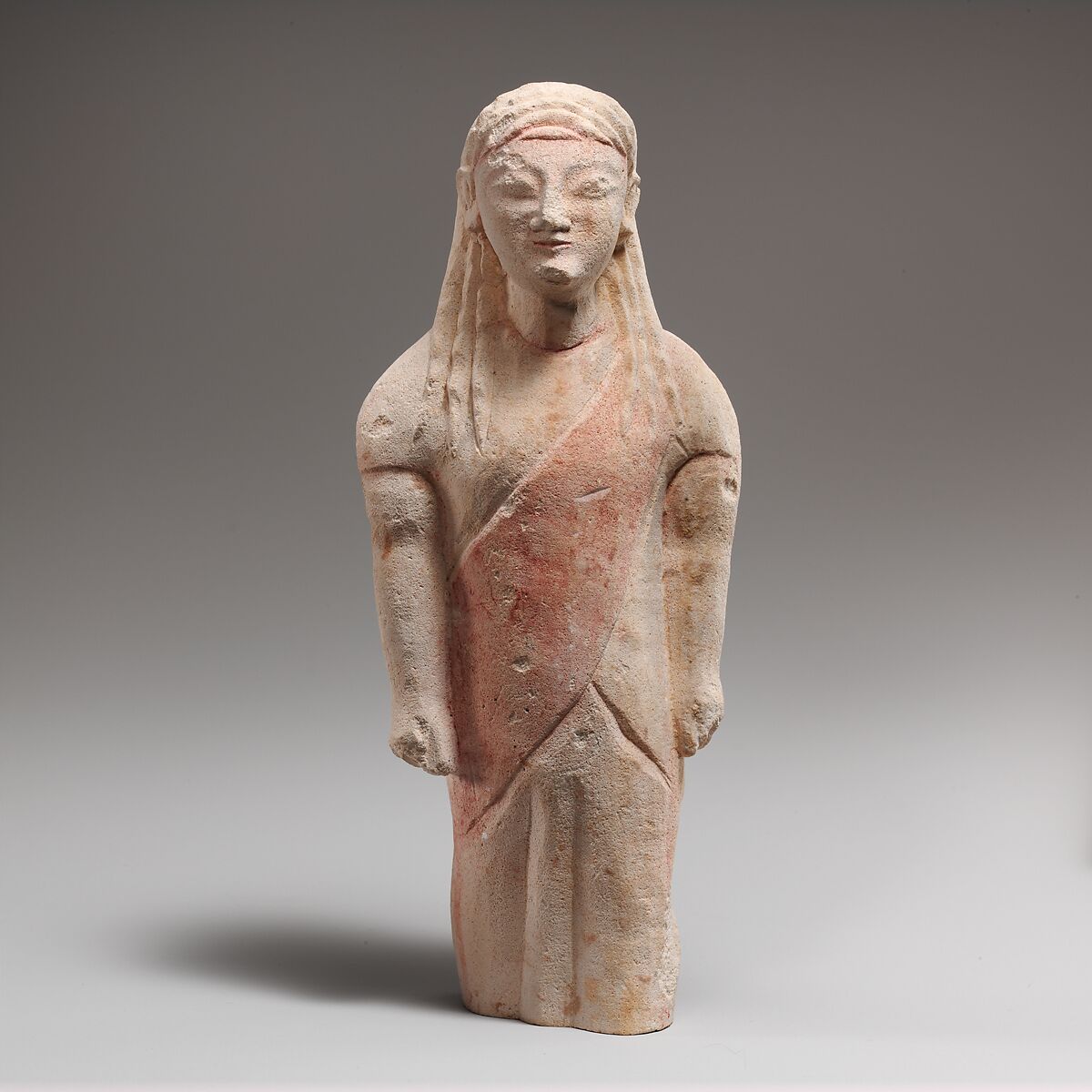 Limestone statuette of beardless male votary in Greek dress, Limestone, Cypriot 