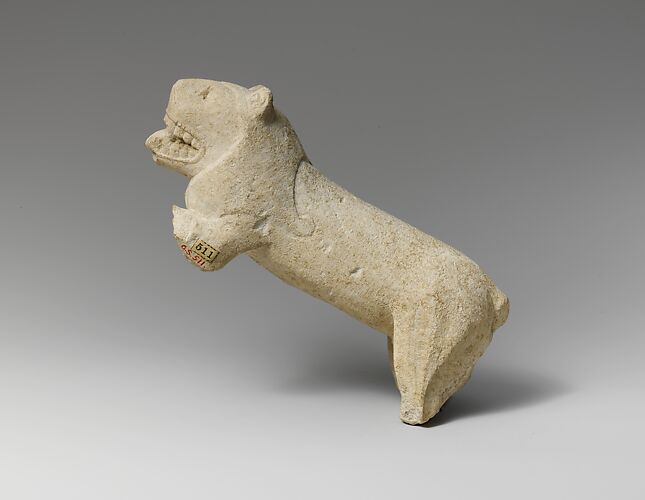 Limestone statuette of a lion