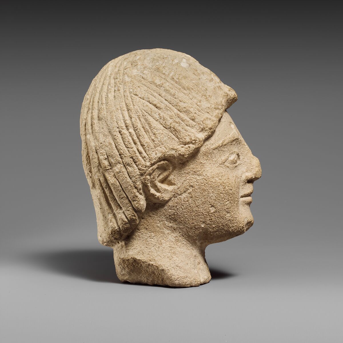 Limestone head of a beardless male votary, Limestone, Cypriot