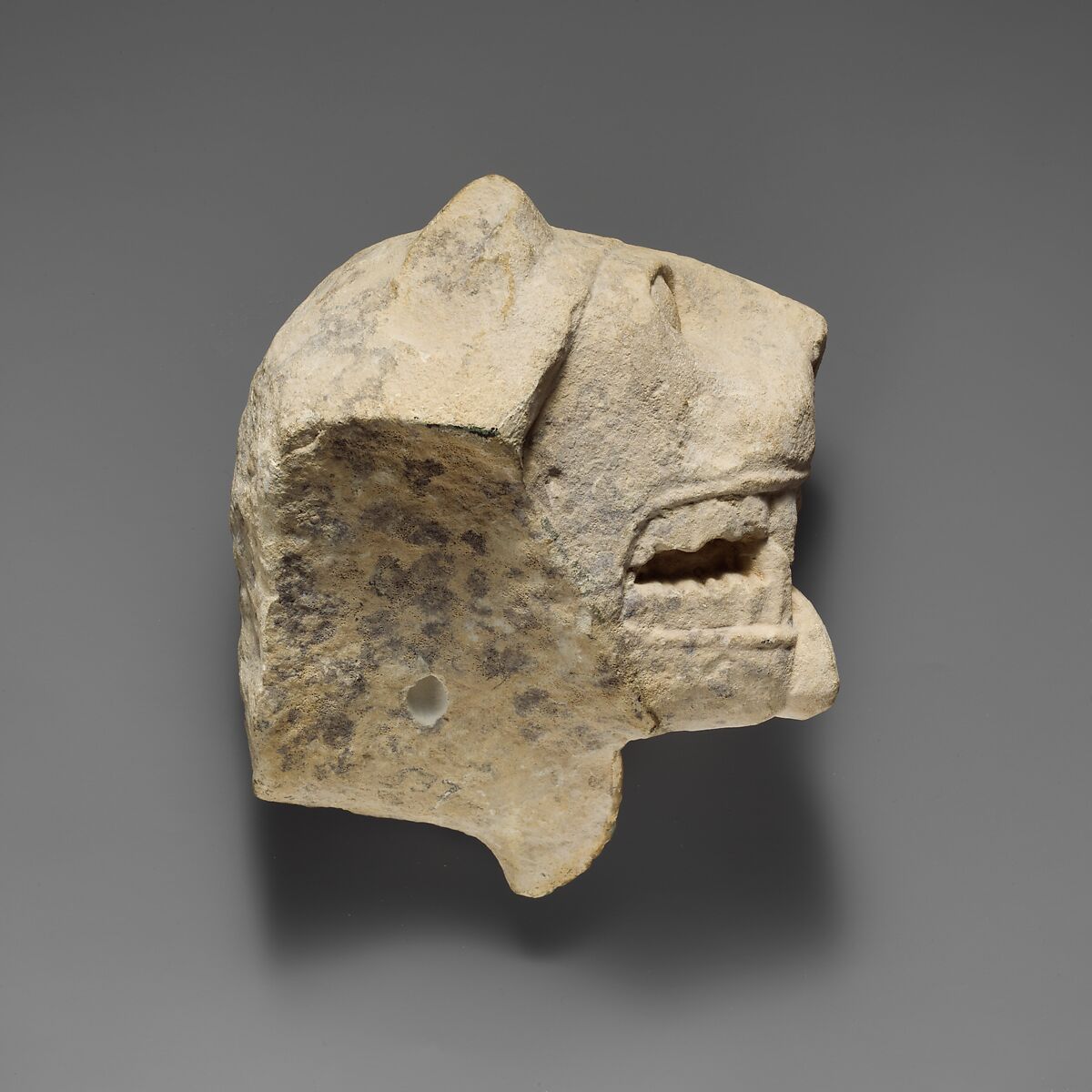 Limestone head of a lion from a votive stele (?), Limestone, Cypriot