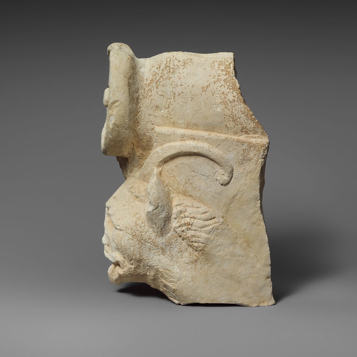 Fragment of a limestone throne (?) with the head of a horned lion, Limestone, Cypriot