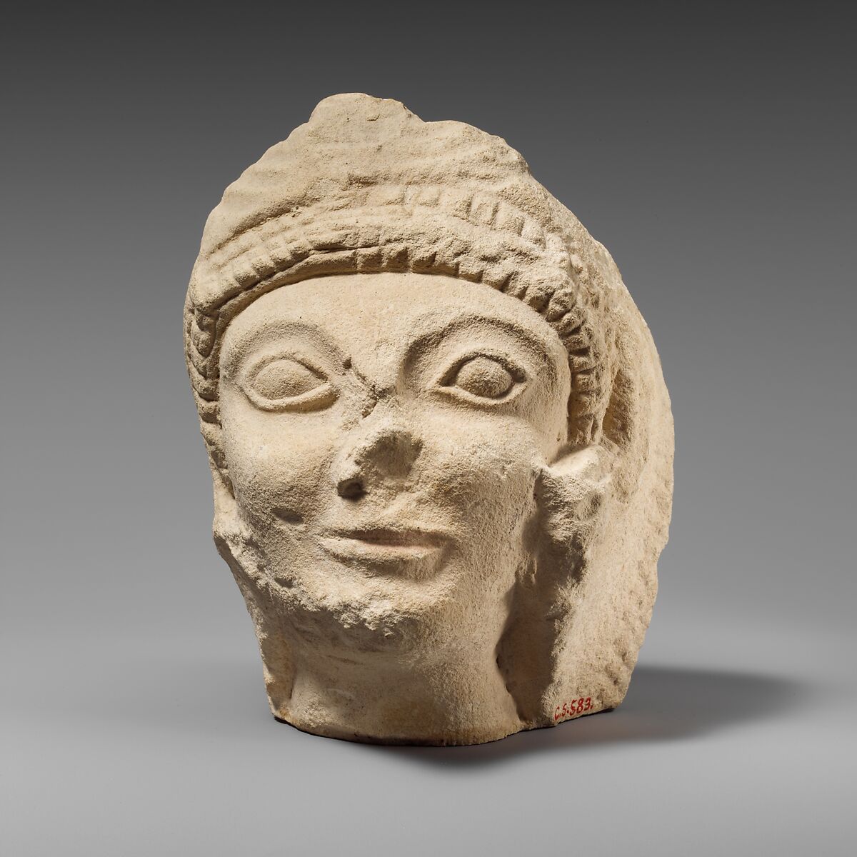 Limestone head of Herakles wearing the lion skin, Limestone, Cypriot 