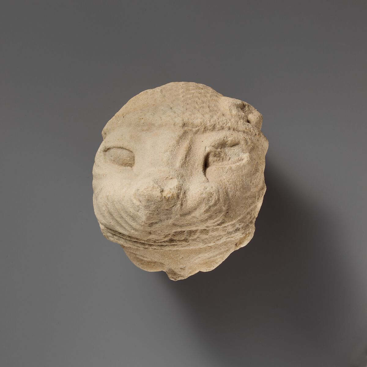 Limestone head of Herakles wearing the lion skin, Limestone, Cypriot
