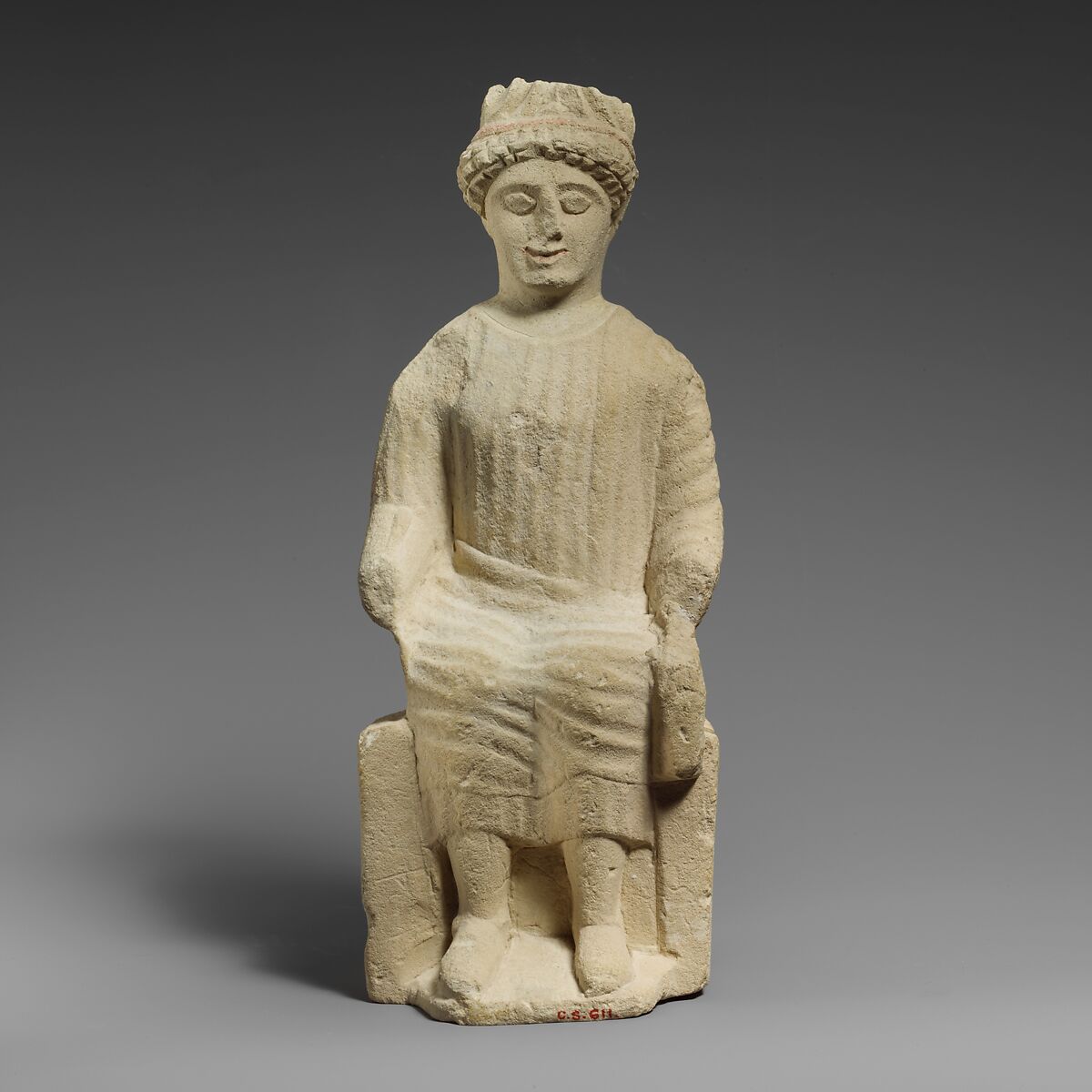 Limestone statuette of a seated beardless male votary, Limestone, Cypriot 
