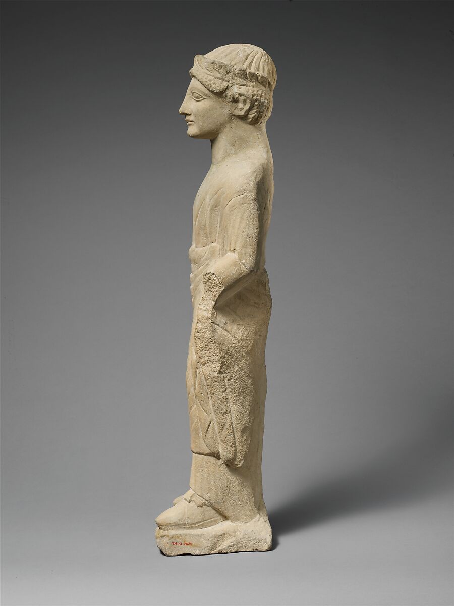 Limestone statuette of a beardless male votary with a wreath of leaves, Limestone, Cypriot