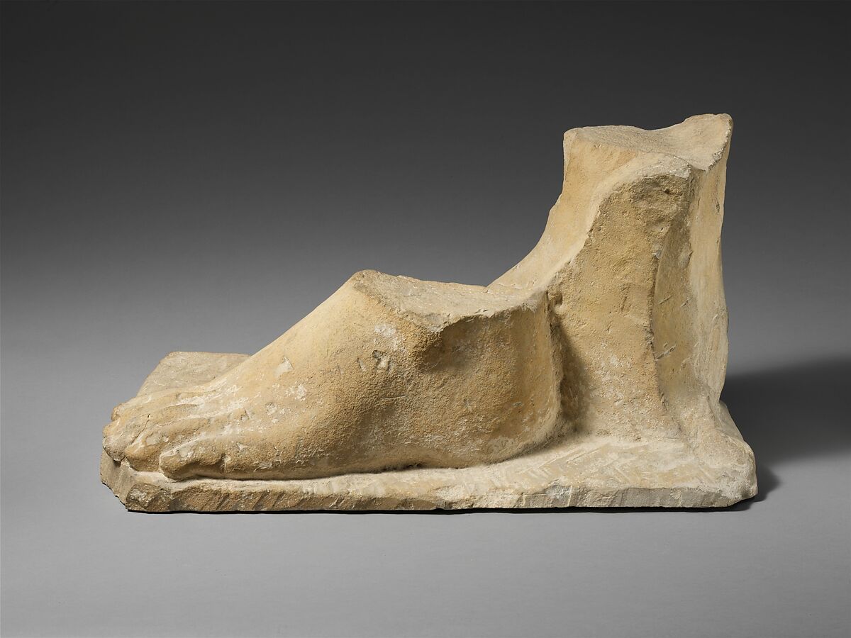 Limestone plinth with the feet of a colossal male statue, Limestone, Cypriot