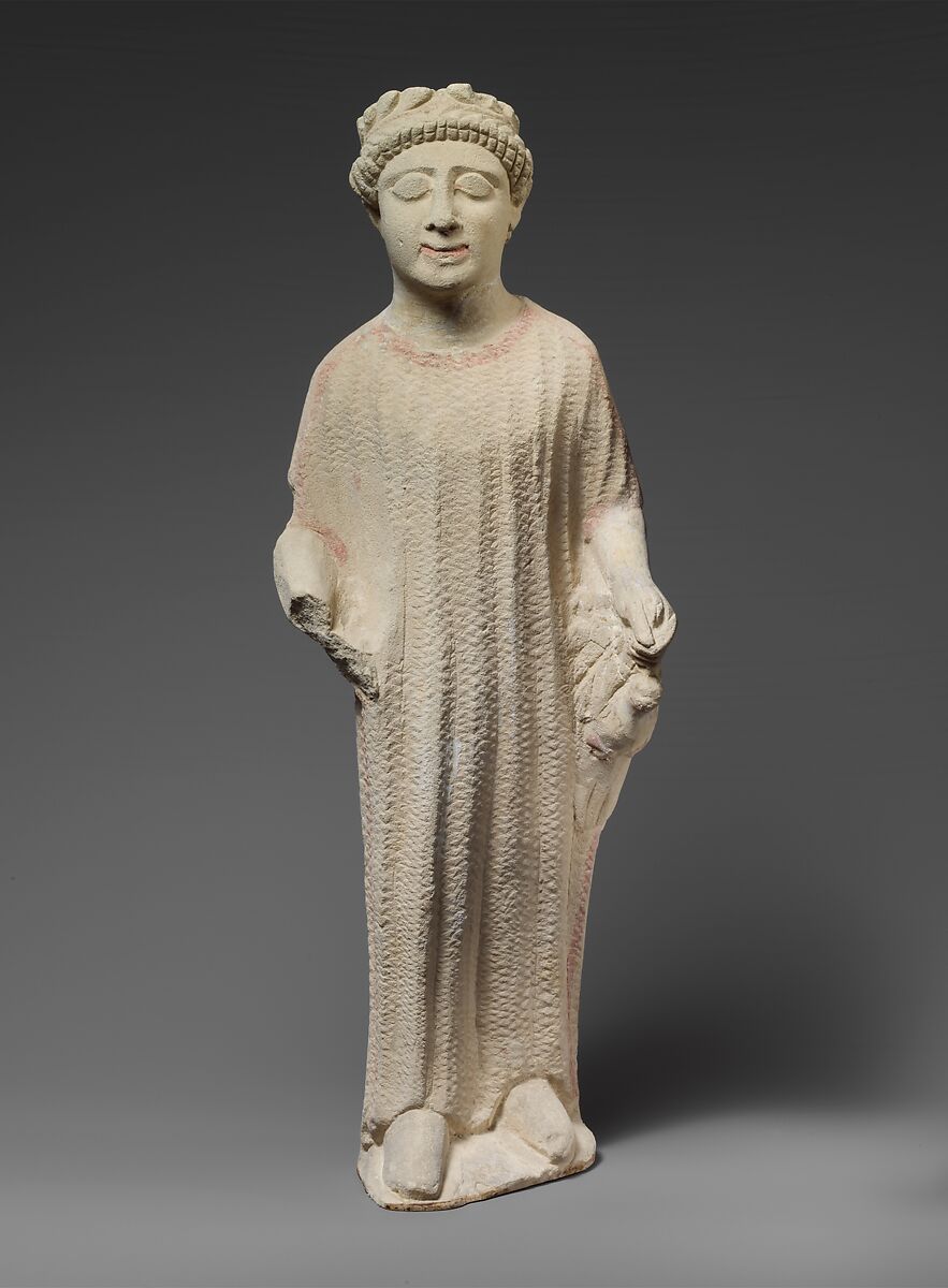 Limestone statuette of a boy holding a dove, Limestone, Cypriot 