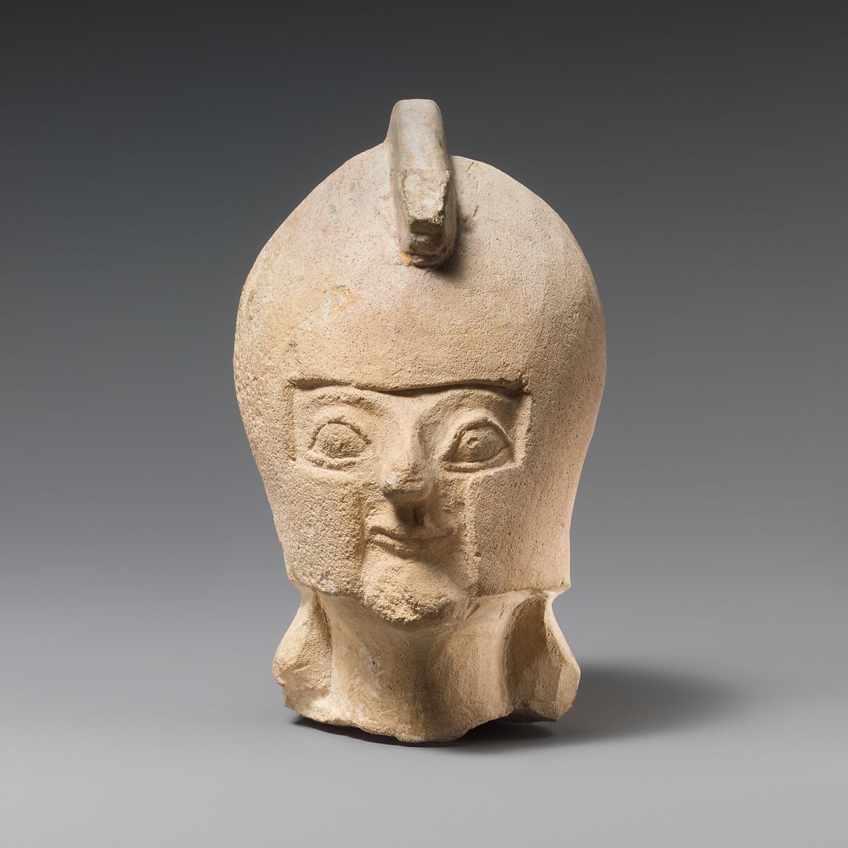 Limestone head of a warrior wearing a crested helmet, Limestone, Cypriot